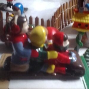 Dept. 56 kids on sled and birdhouse